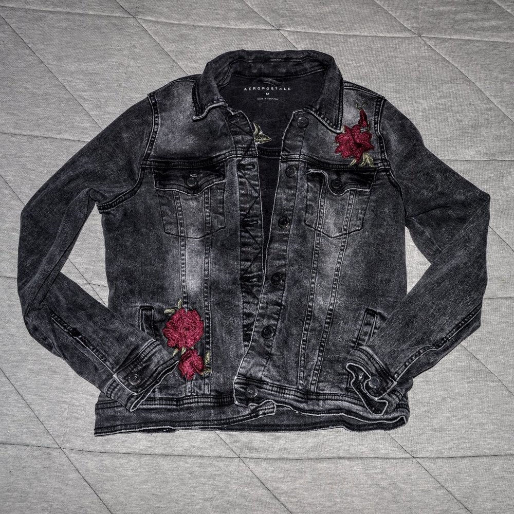 Black embroidered jean jacket.